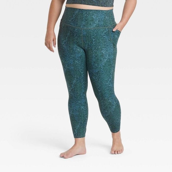 Model wearing the dark green contour flex lace-up leggings