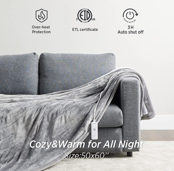 A heated blanket draped over a couch, ready for use.