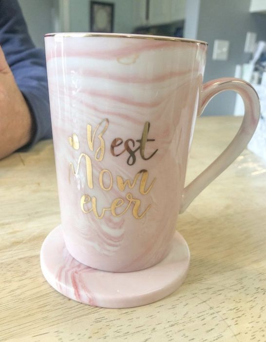 the mug resting on top of its coaster