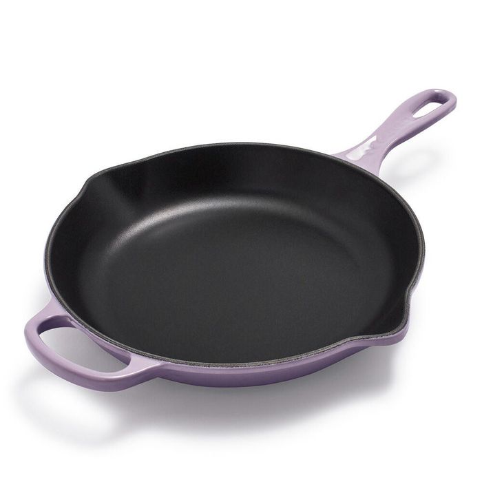 The purple pan, a charming addition to any kitchen, stands out with its bold color and sleek design.