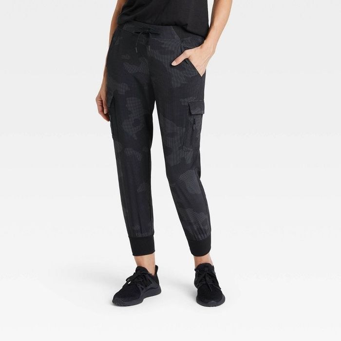 Model showing off the dark gray stretch-woven cargo pants