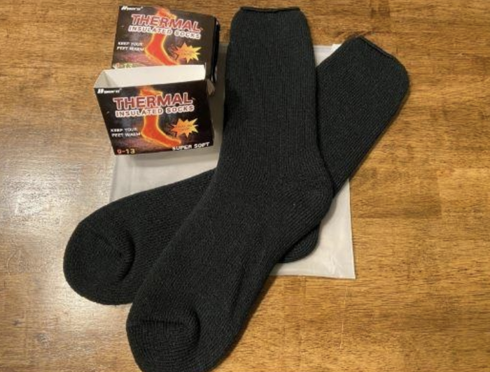 A photo of insulated socks placed neatly on the floor.
