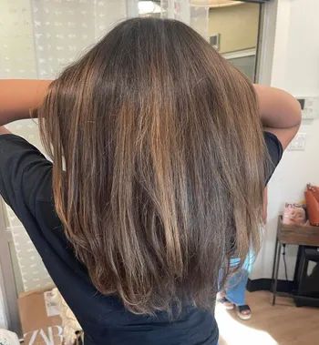 the same reviewer's hair appearing radiant and revitalized post-treatment