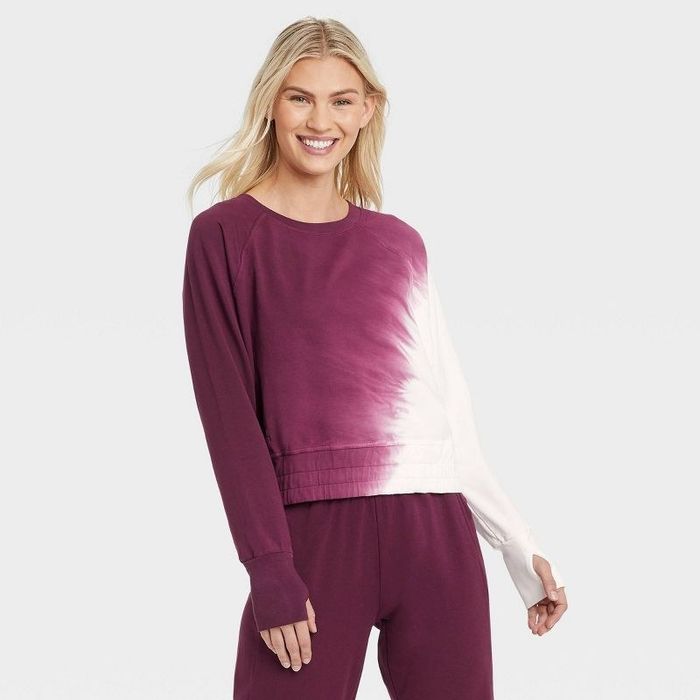 Model wearing the maroon terry tie-dye pullover
