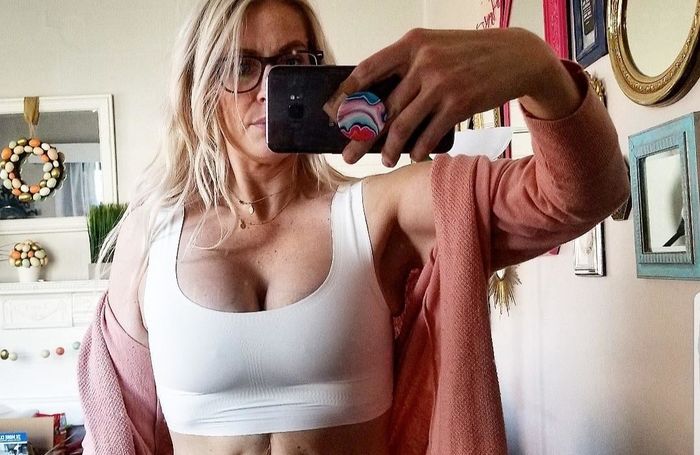 A reviewer's mirror photo wearing the bra