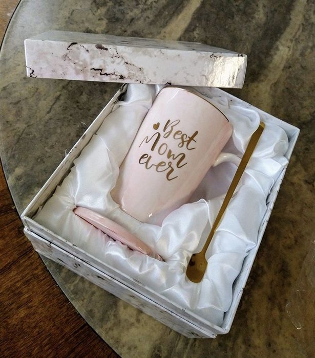 the mug, coaster, and mixer neatly arranged inside its box