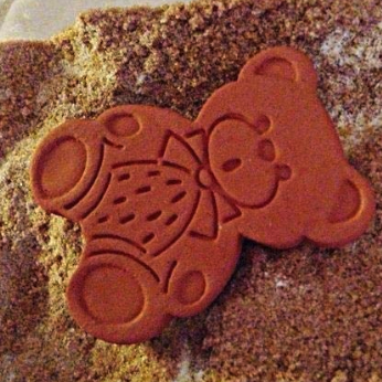 the same bear resting on a pile of sugar