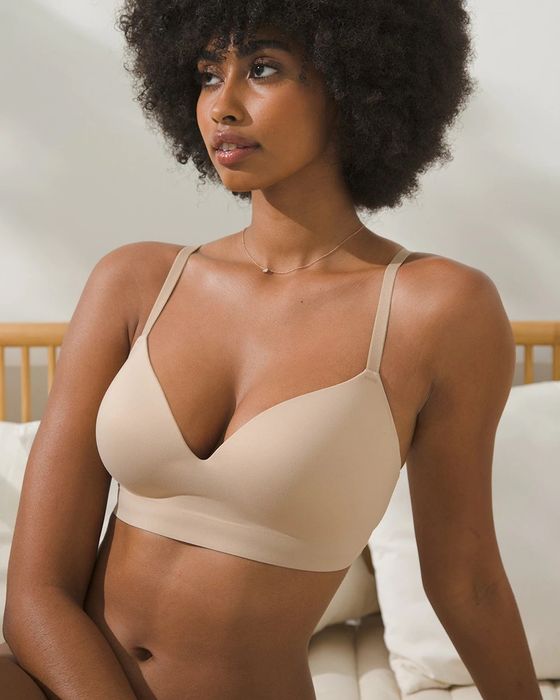 A model posing in a nude wireless bra