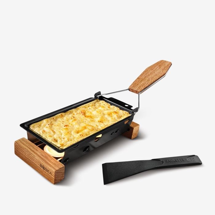 the raclette brimming with melted cheese