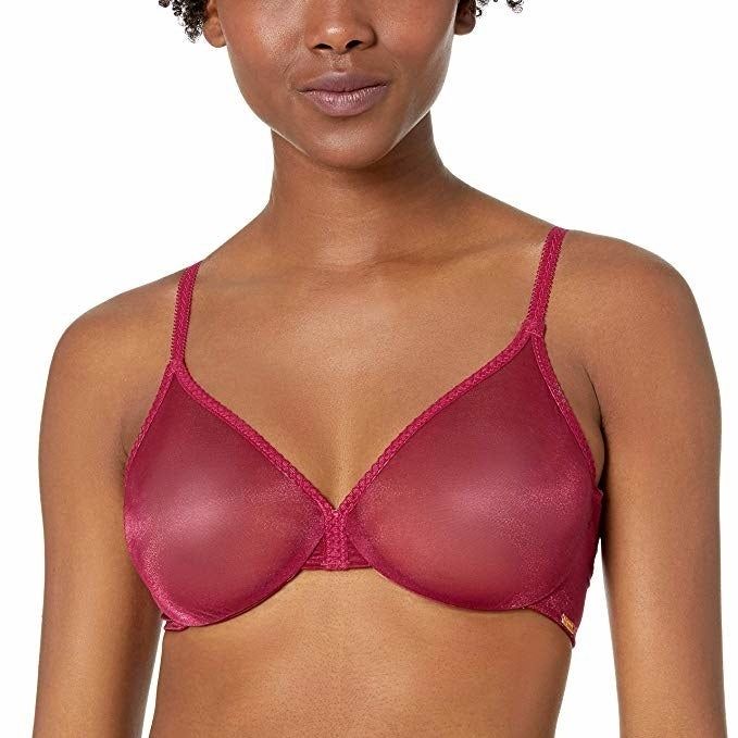 A model wearing the bra in a vibrant magenta shade