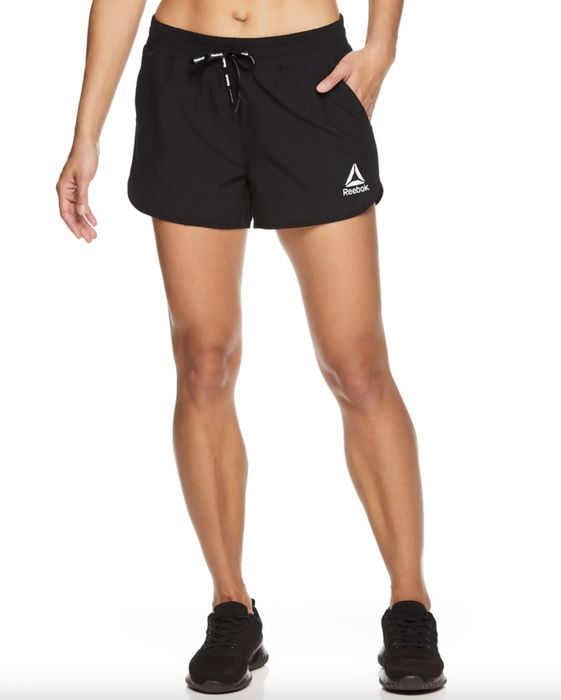 A pair of black shorts and sneakers