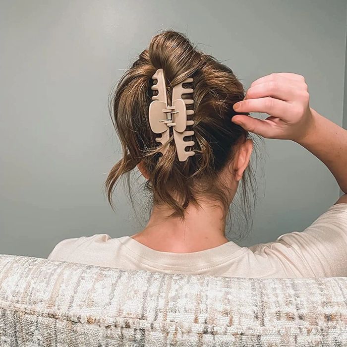 The back of the reviewer's hair with a beige claw clip securing the hair