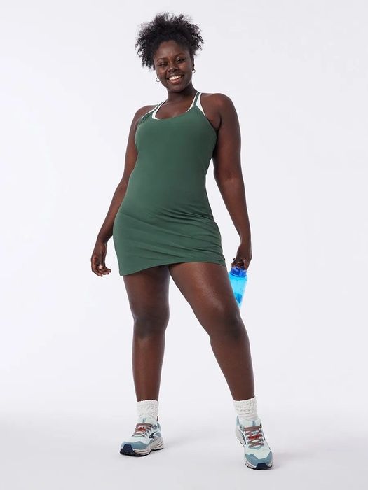 model wearing the green exercise dress