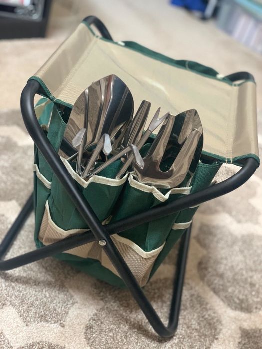 The tools neatly stored in a caddy placed on a folding seat