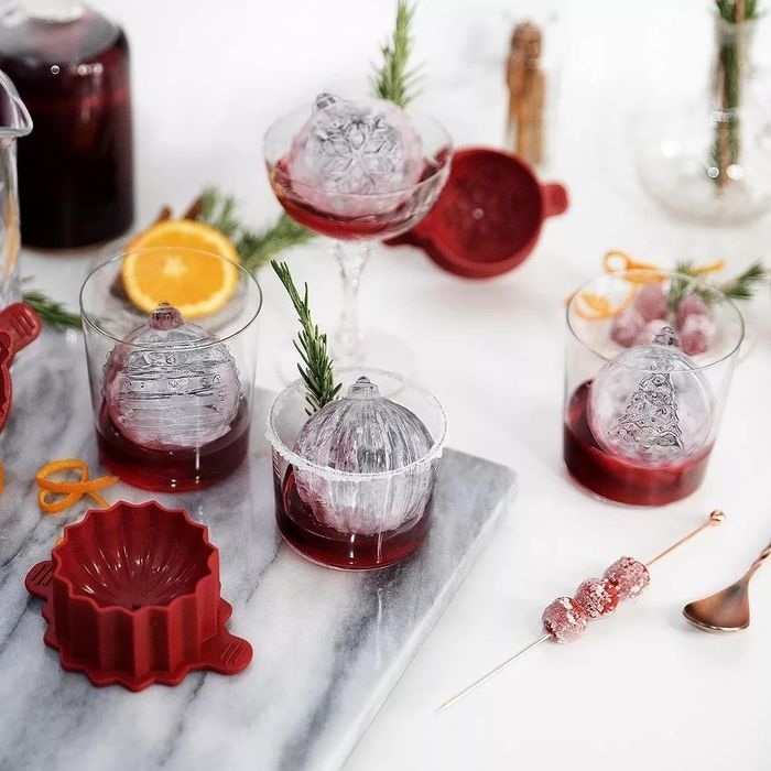 The ice molds and shaped ice spheres neatly arranged on a counter.