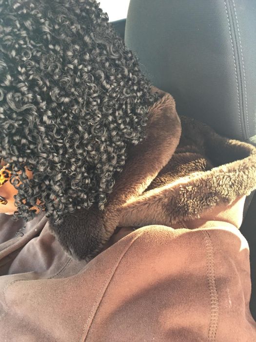 A reviewer showing off their moisturized curls
