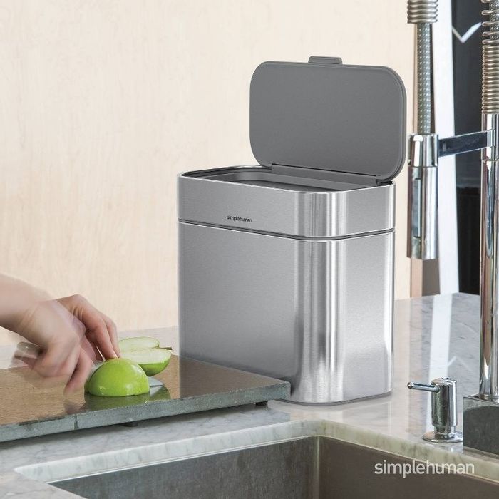 The compost bin resting on a countertop