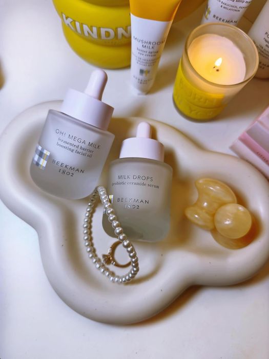 A cloud-shaped dish used by a reviewer, holding a collection of skincare products.