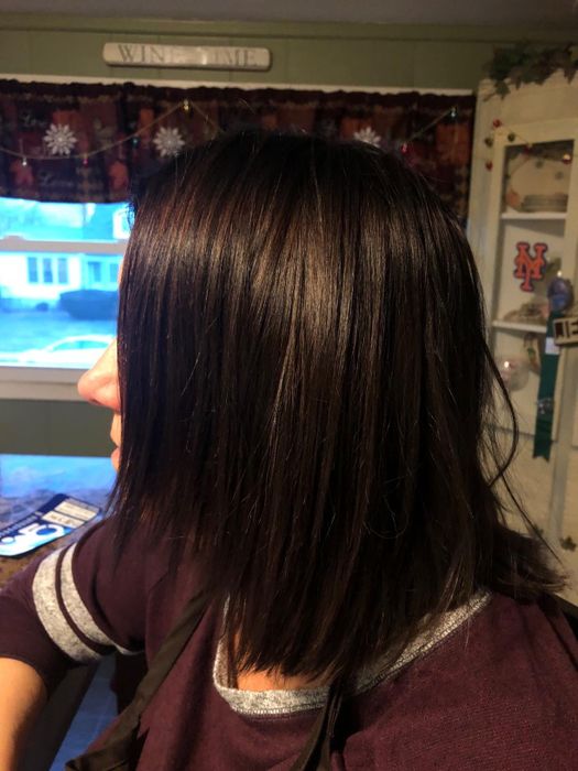 A review showing hair that's smooth and shiny after use