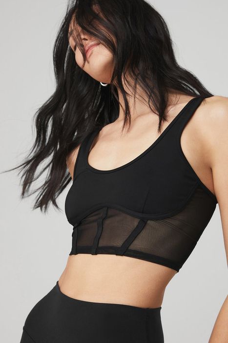 model showcasing the black mesh tank