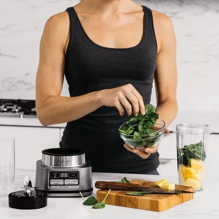 Image of a person preparing a smoothie