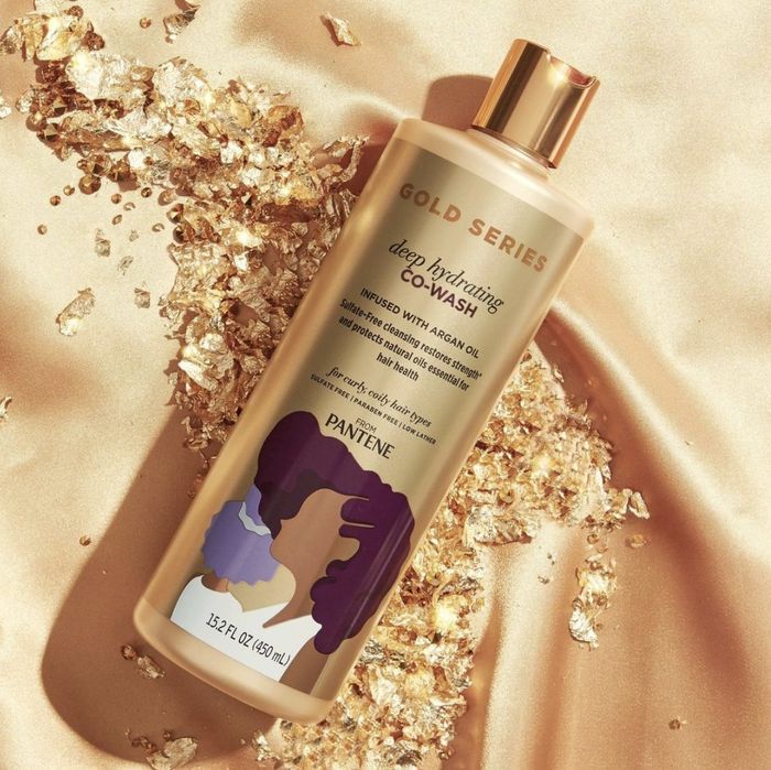 A gold bottle of cleansing conditioner