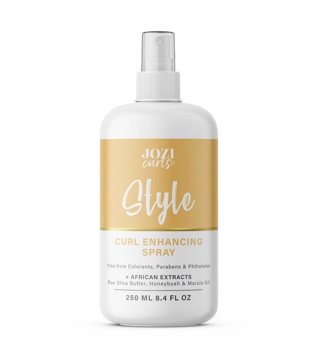A bottle of curl-enhancing styling spray