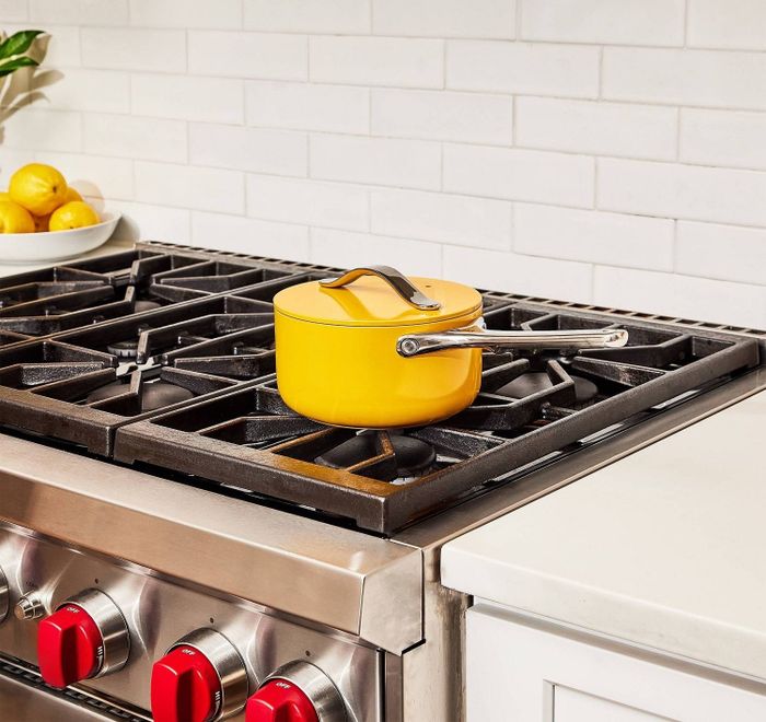 The bright yellow saucepan with a lid.