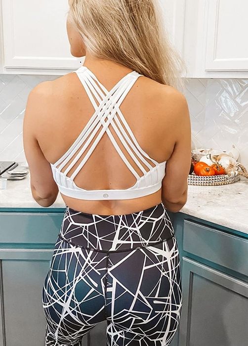 back view of reviewer wearing the white bra with a different strap pattern