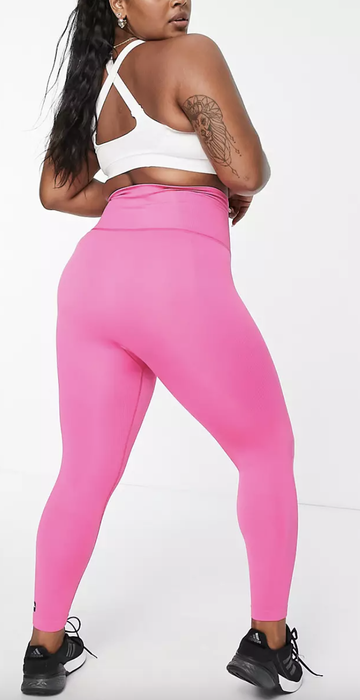 back view of model wearing the pink leggings