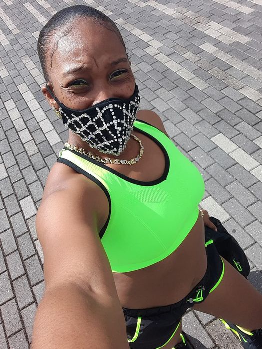 reviewer wearing the neon green sports bra