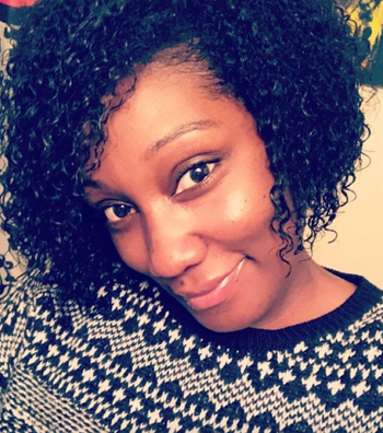 Reviewer with refreshed curls after using the spray