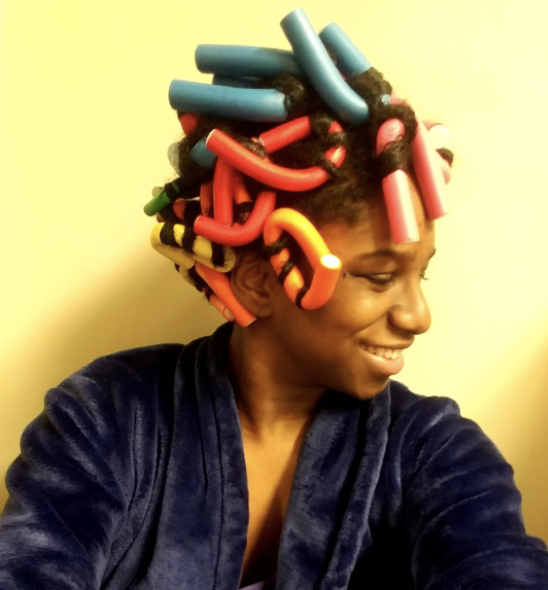 Photo of a reviewer's hair styled with curling rods