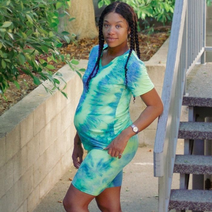 A reviewer models a green and blue tie-dye set, radiating a fresh and lively vibe perfect for an active day.