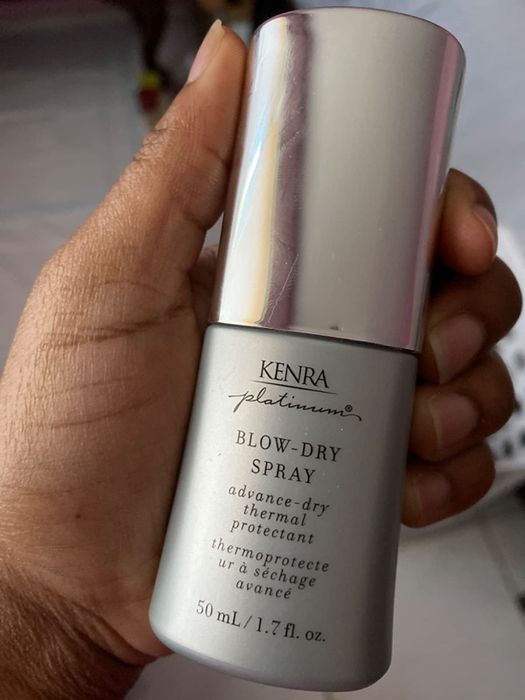 A reviewer holding the product in their hand.