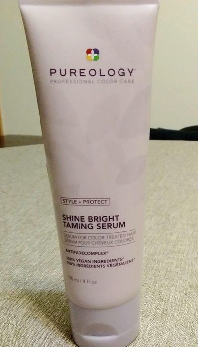 Reviewer's bottle of the product placed on a table