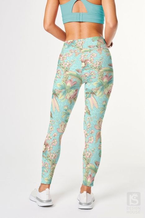 The model is captured from behind, flaunting the leggings in full view.