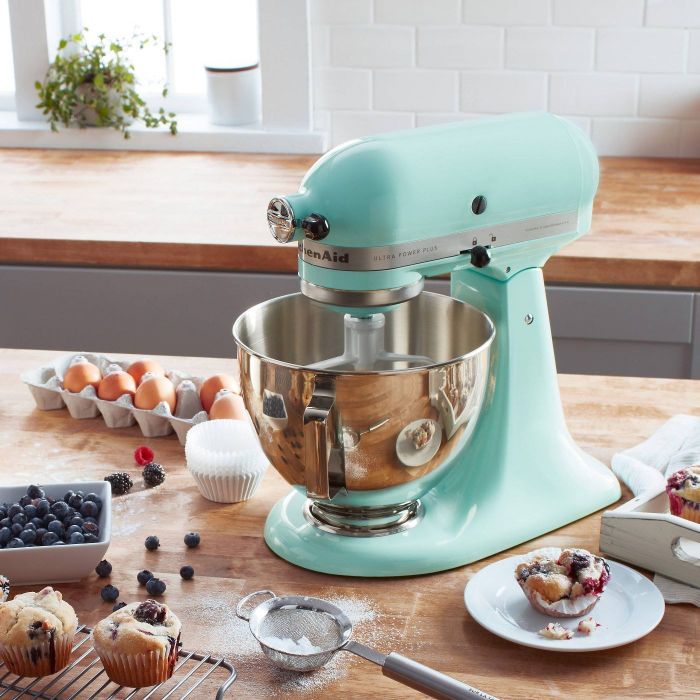 An ice blue KitchenAid mixer rests elegantly on a countertop