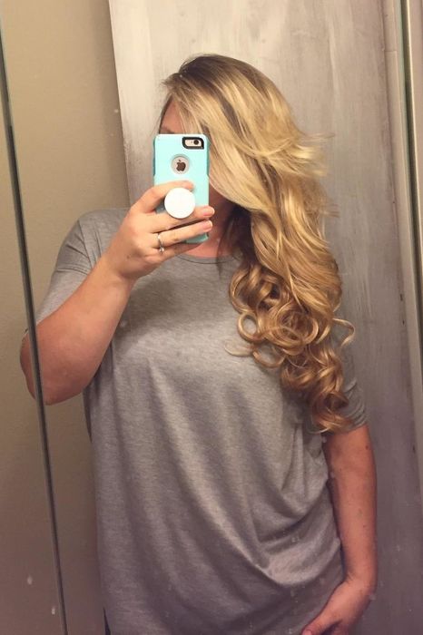 The same reviewer wearing the hair extensions.