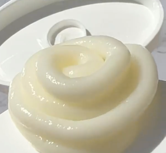 A close-up shot of the hair mask, showing its spiral texture