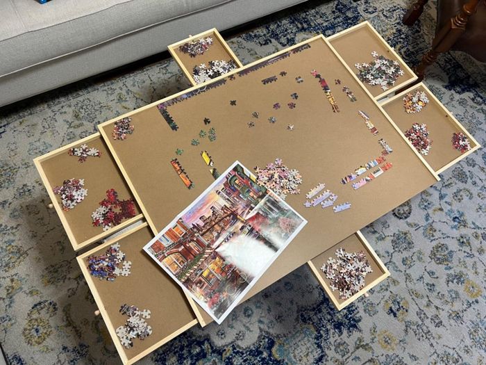 A reviewer's image of the puzzle table, showcasing its design and functionality.
