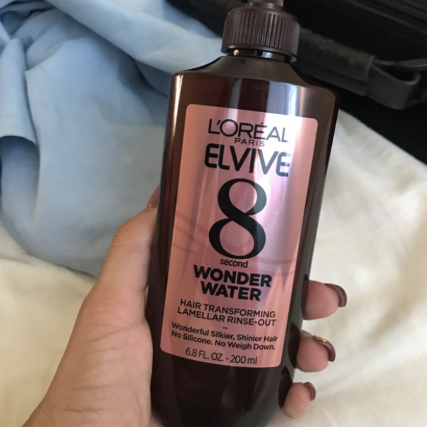 Photo of Wonder Water being held by a reviewer