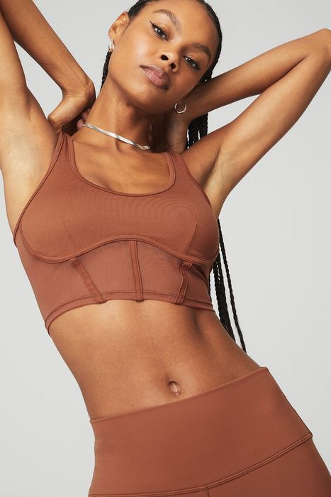 model showcasing the brown mesh tank