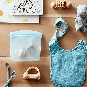 A transparent aqua-colored Stasher bag