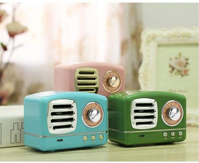 Compact retro-style radio speakers available in vibrant blue, green, and pink