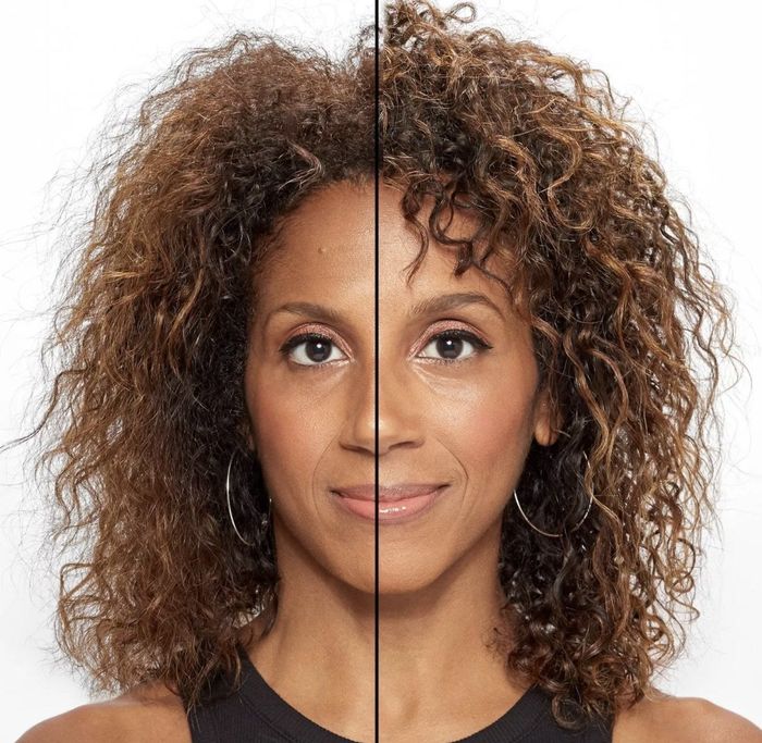 An adult with curly hair shows one side of their head with the product applied, resulting in tight, soft curls, while the other side remains loose with frizzy curls.
