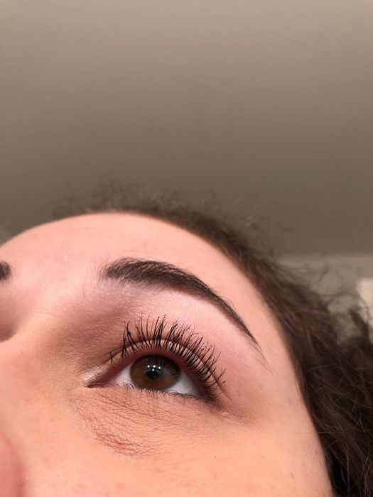 A reviewer's lashes, clump-free after using the eyelash comb