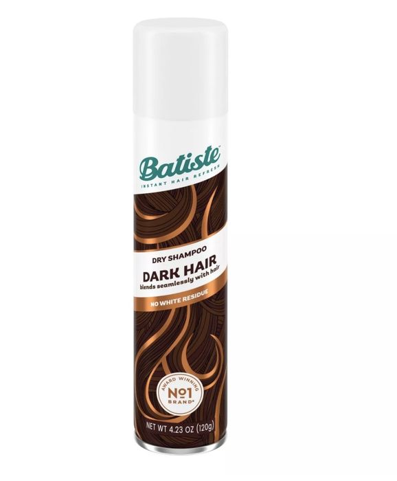 The bottle displays dark and gold strands of hair with the words 