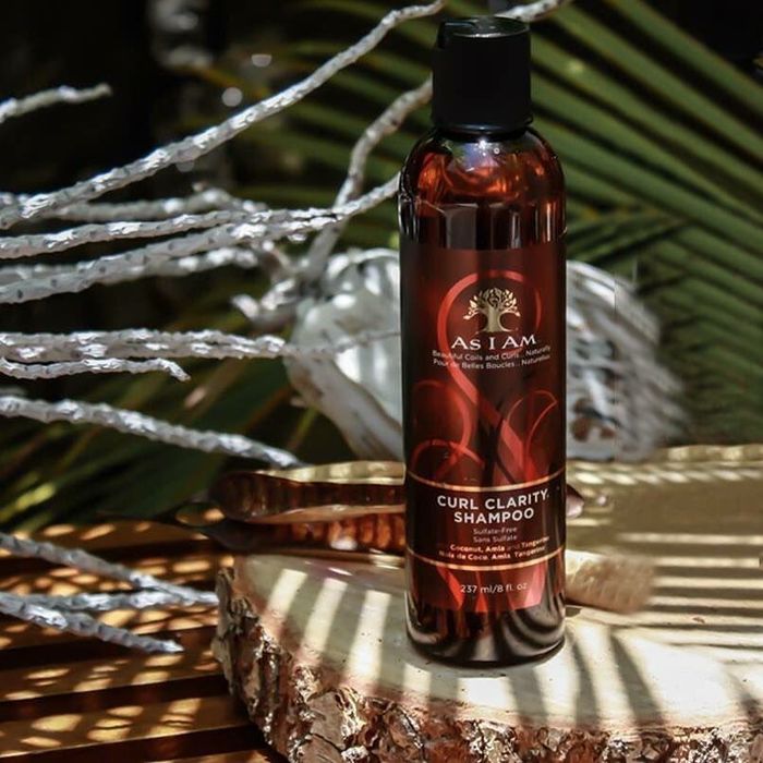A bottle of the Curl Clarity Shampoo, designed to enhance and maintain curly hair.