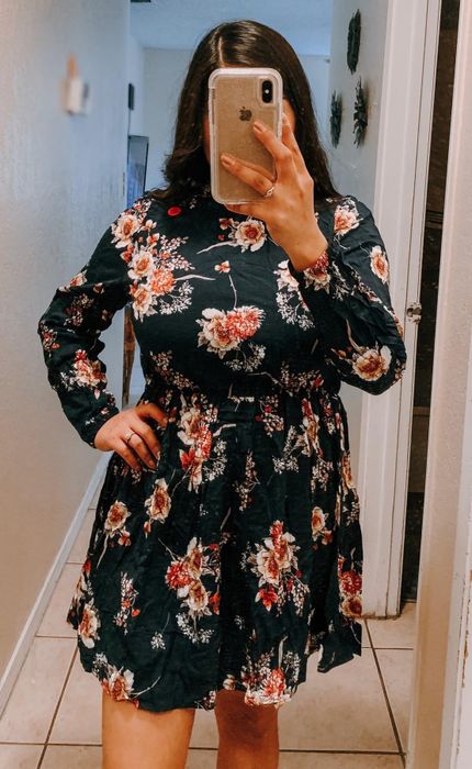 A reviewer’s photo showcasing them in a floral dress